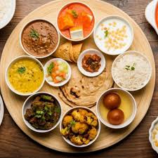 a wooden thali contains satvik meal"rishi adiyog peeth"